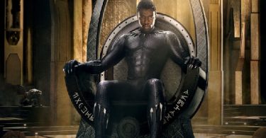 Promo photo of Chadwick Boseman as Black Panther sitting on his throne