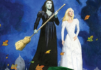 Wicked Graphic Novel Part 1 cover featuring Elphaba dressed in black with her broom and Glinda next to her in white.